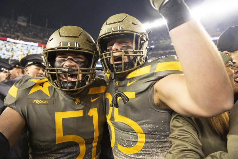 Army West Point football played the Navy Midshipmen in the 123rd annual Army-Navy Game Dec. 10 at Lincoln Financial Field in Philadelphia. For the first time in history, the Army-Navy Game was decided in overtime with the Black Knights kicking a 39-yard field goal for the 20-17 double-overtime victory. (Above, left and below) Cadets, Army players and head coach Jeff Monken celebrate with each other after the victory.    		Photo by John Pellino/USMA PAO