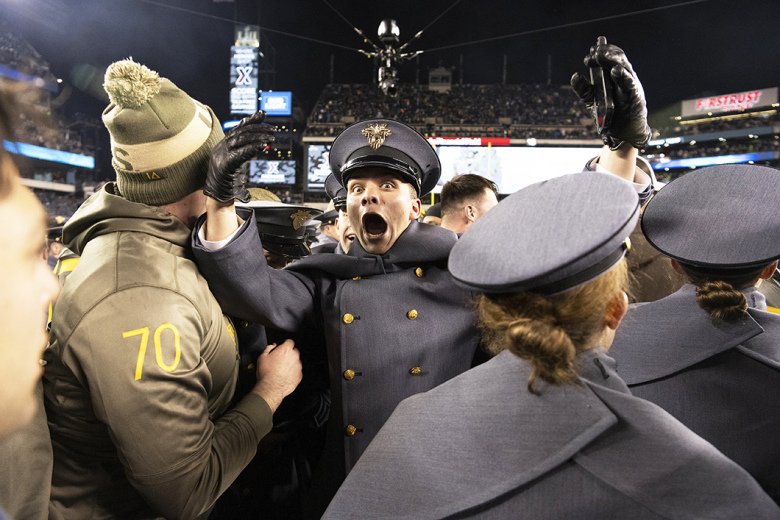 Army West Point football played the Navy Midshipmen in the 123rd annual Army-Navy Game Dec. 10 at Lincoln Financial Field in Philadelphia. For the first time in history, the Army-Navy Game was decided in overtime with the Black Knights kicking a 39-yard field goal for the 20-17 double-overtime victory. (Above, left and below) Cadets, Army players and head coach Jeff Monken celebrate with each other after the victory.    		Photo by John Pellino/USMA PAO