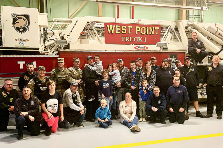 Community members pose for a group photo at the Nov. 10 West Point Fire Department Open House.   		 (Photo by Jill Mitchell)