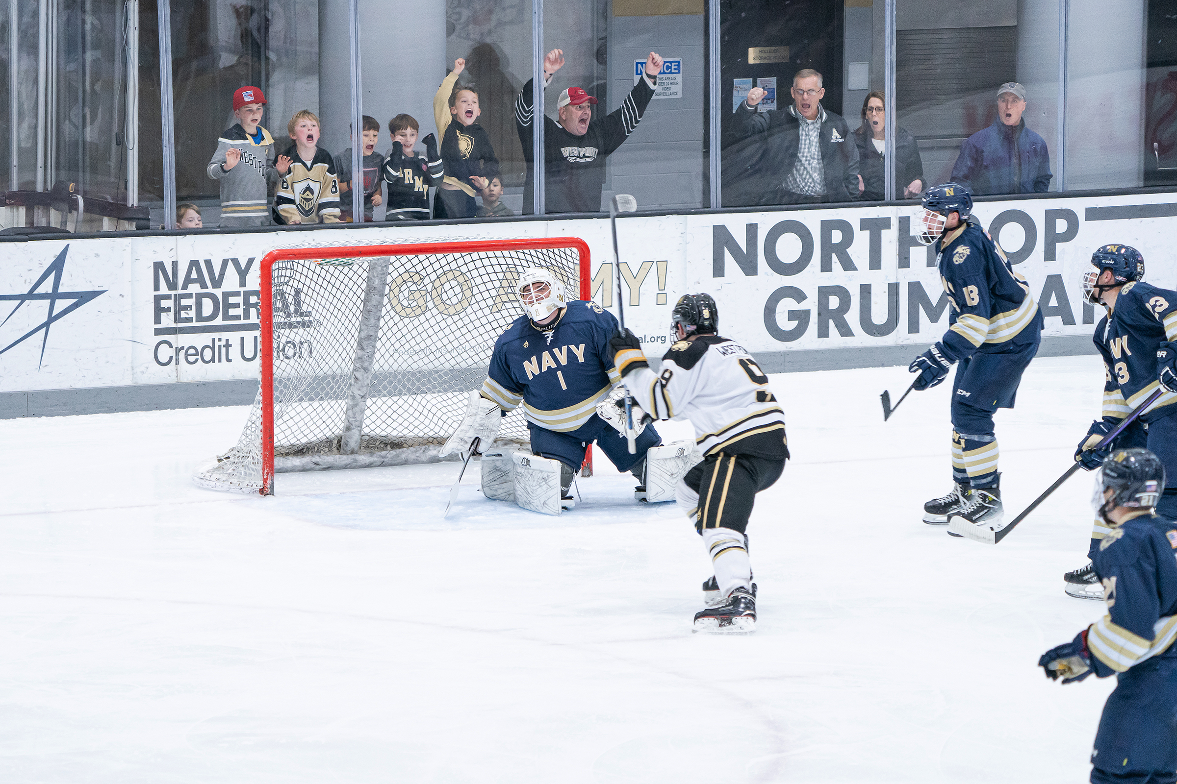 In a lively setting for the first-ever Army-Navy hockey game at Tate Rink on Dec. 2, the Black Knights rolled over the Midshipmen, 6-2, to extend their winning streak to 10 games on the season.    (Photo provided by Army West Point Club Hockey)