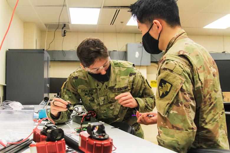 Class of 2023 Cadets Alexander Disalvo (left) and Alvin Ye (right) are working together on a part they will attach to a robot during Academic Majors Open House. Plebe cadets make one of the most important decisions of their educational experience at West Point as they decide what their majors, such as CME, will be from information gathered at  the Academic Majors Open House for the Class of 2024. 