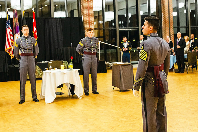 Class of 2022 Cadet Alexander Denha narrates the fallen comrade ceremony with Class of 2022 Cadets Andrew Hipp and Christopher Cameron.