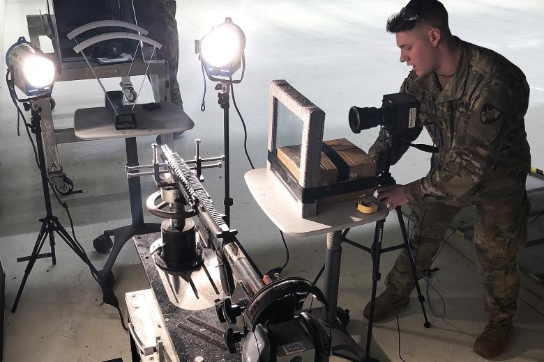 Second Lt. William Morningstar preparing to test an abrasion resistant steel panel.	