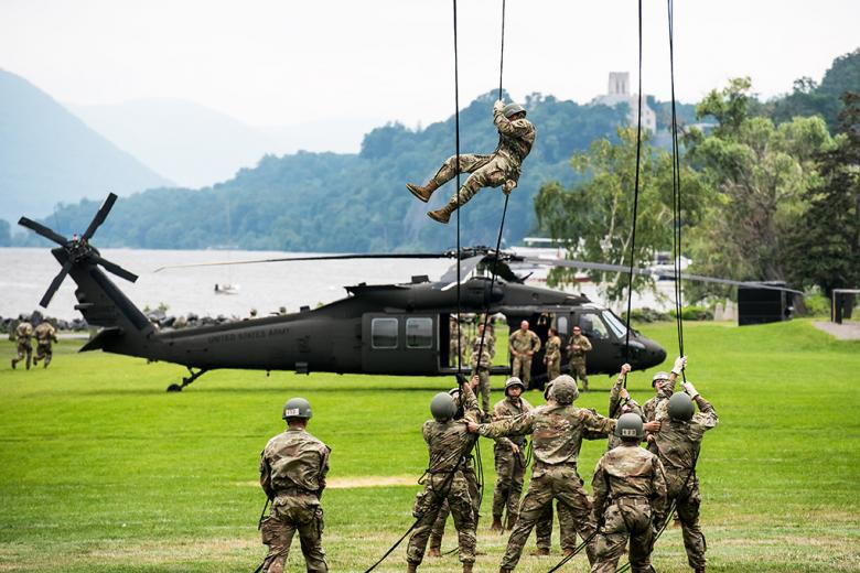 A cadet rappels down from a UH-60 Black Hawk during the rappelling portion of the Air Assault Course, which is a 10-day course involving a six-mile march, training in combat assault, sling loads and rappelling, an obstacle course  and a two-mile run. It also involves a 12-mile road march on graduation day to earn the coveted Air Assault wings.   Photo by Elizabeth Woodruff/USMA PAO 