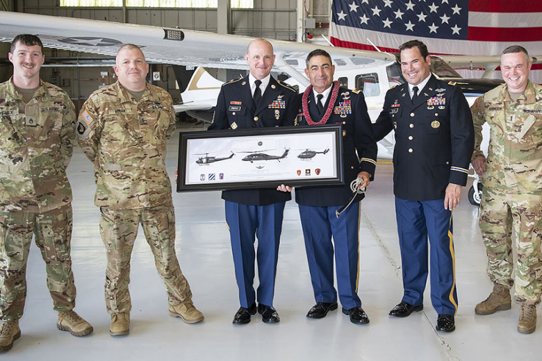 (Photo from left to right) Soldiers from U.S. Military Academy’s 2nd Aviation Detachment — Staff Sgt. Mathew Heney, CW4 Joshua Bosak, Sgt. 1st Class Mark Proffitt, CW5 Joseph Roland, CW3 Kenneth Rudo and CW4 Joseph Karmozyn smile for a group photo after presenting Roland with farewell gifts.   Photo by Kyle Osterhoudt/USMA PAO