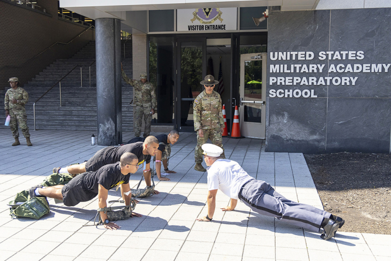 Cadet candidates who reported for Reception Day on Monday get into the front leaning rest position prior to doing pushups at the U.S. Military Academy Preparatory School. 