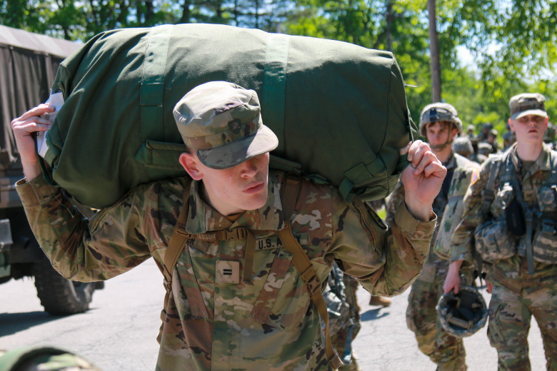 A U.S. Military Academy cadet carries his duffel bag as he prepares for the upcoming Cadet Field Training May 29 at Camp Buckner.