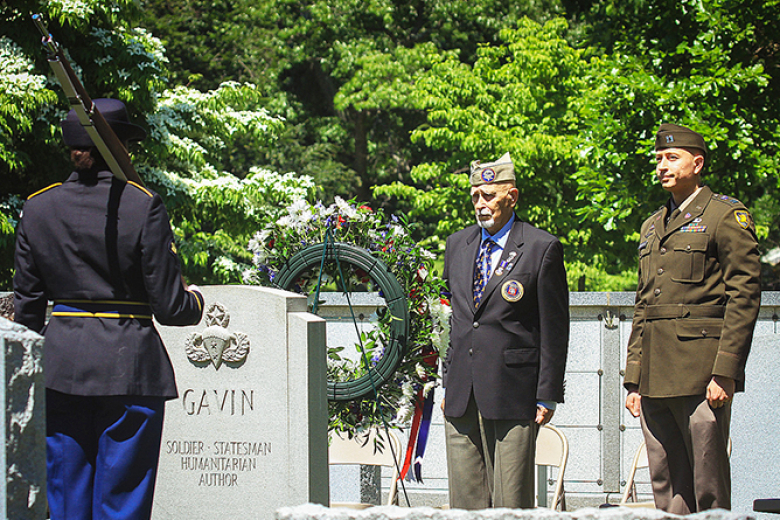 A wreath-laying ceremony to honor Lt. Gen. James Gavin, U.S. Military Academy 1929 graduate, at his gravestone took place Monday at the West Point Cemetery. (Top left, bottom left and above) Larry Lenahan, a member of the 82nd Airborne Division Association, and Department of History Capt. Michael Matheny place a wreath at Gavinʼs gravestone with members of the Military Police Color Guard and Firing Party also a part of the ceremony. 