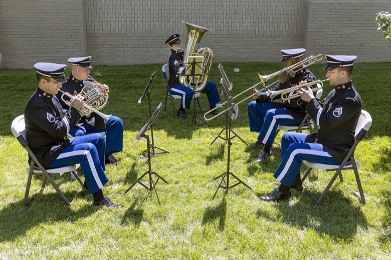 The ceremony concluded with a moment of silence in memory of D-Day and the West Point Band’s (bottom right) rendition of George M. Cohan’s 1917 song, “Over There.”     Photos by Christopher Hennen/USMA PAO