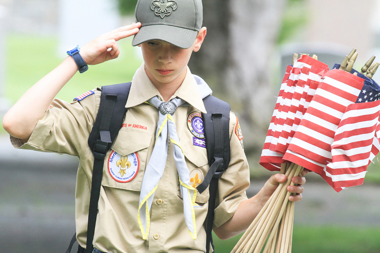 Members of the Boy Scouts of America and Girl Scouts of America planted flags at each headstone in the West Point Cemetery May 26 to honor those who served and those who died in service to the United States. The honor was done prior to Memorial Day, which honors service members who made the ultimate sacrifice to the nation.  												                                  Photos by Jorge Garcia/PV