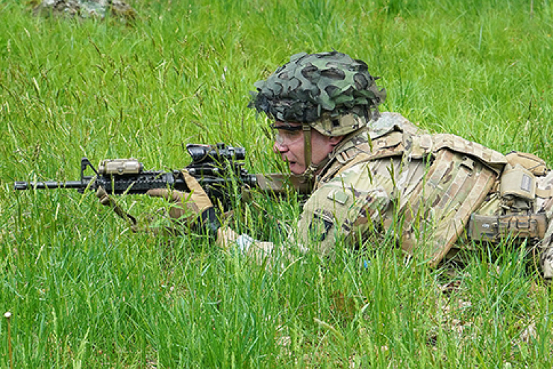 Sgt. Matthew Cipparone, a fire team leader with Task Force Leader, shouts out commands during a team live-fire demonstration conducted as part of a training validation held by the Department of Military Instruction May 17 at Range 17.
