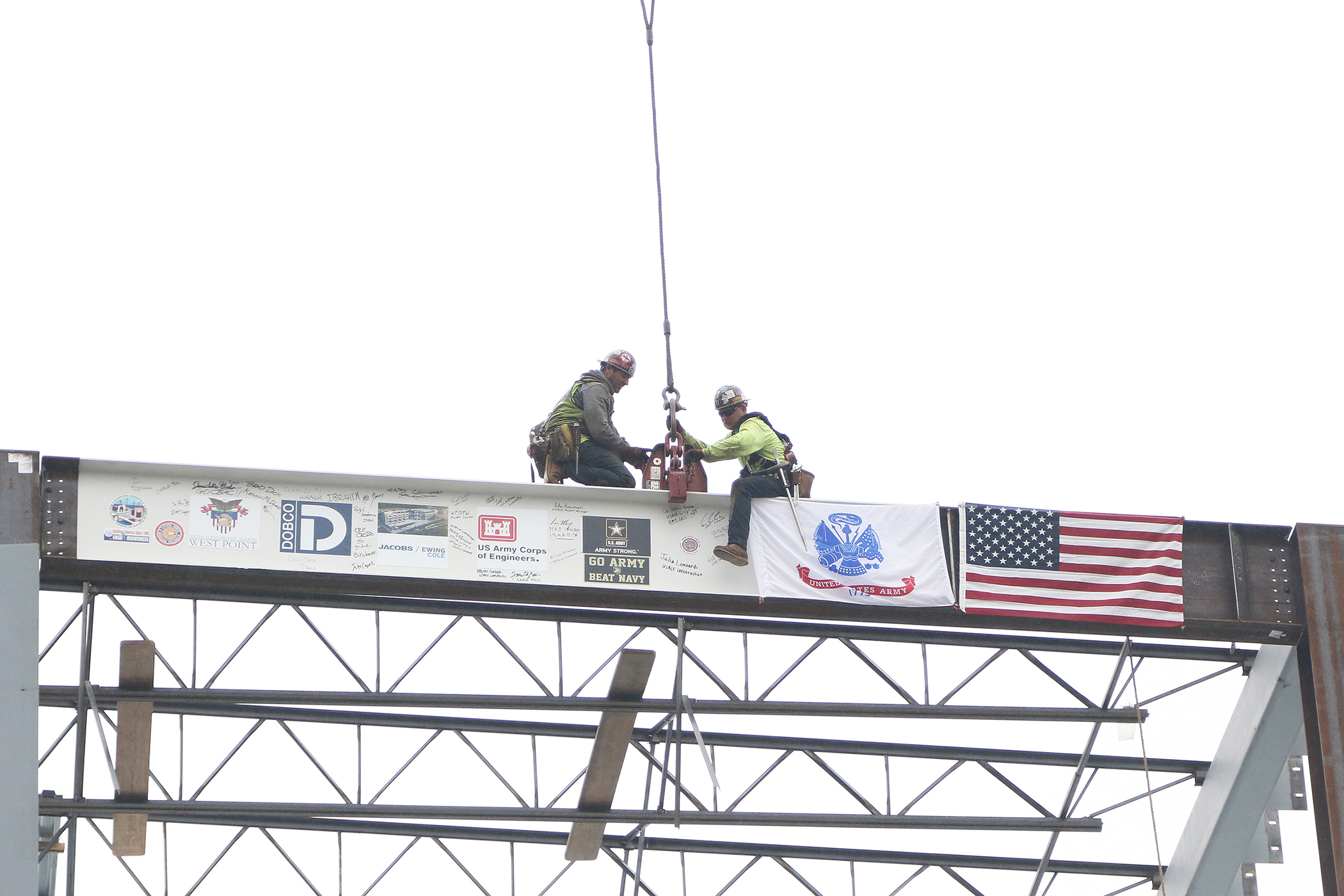 One of the final beams was placed on top of the future Cyber and Engineering Academic Center (CEAC) during a ceremony June 22 at the U.S. Military Academy. Traditionally, a beam topping ceremony is the celebration of the last beam placed on the building and marks a major milestone in the construction process of that building.  (Photo by Eric S. Bartelt/PV)