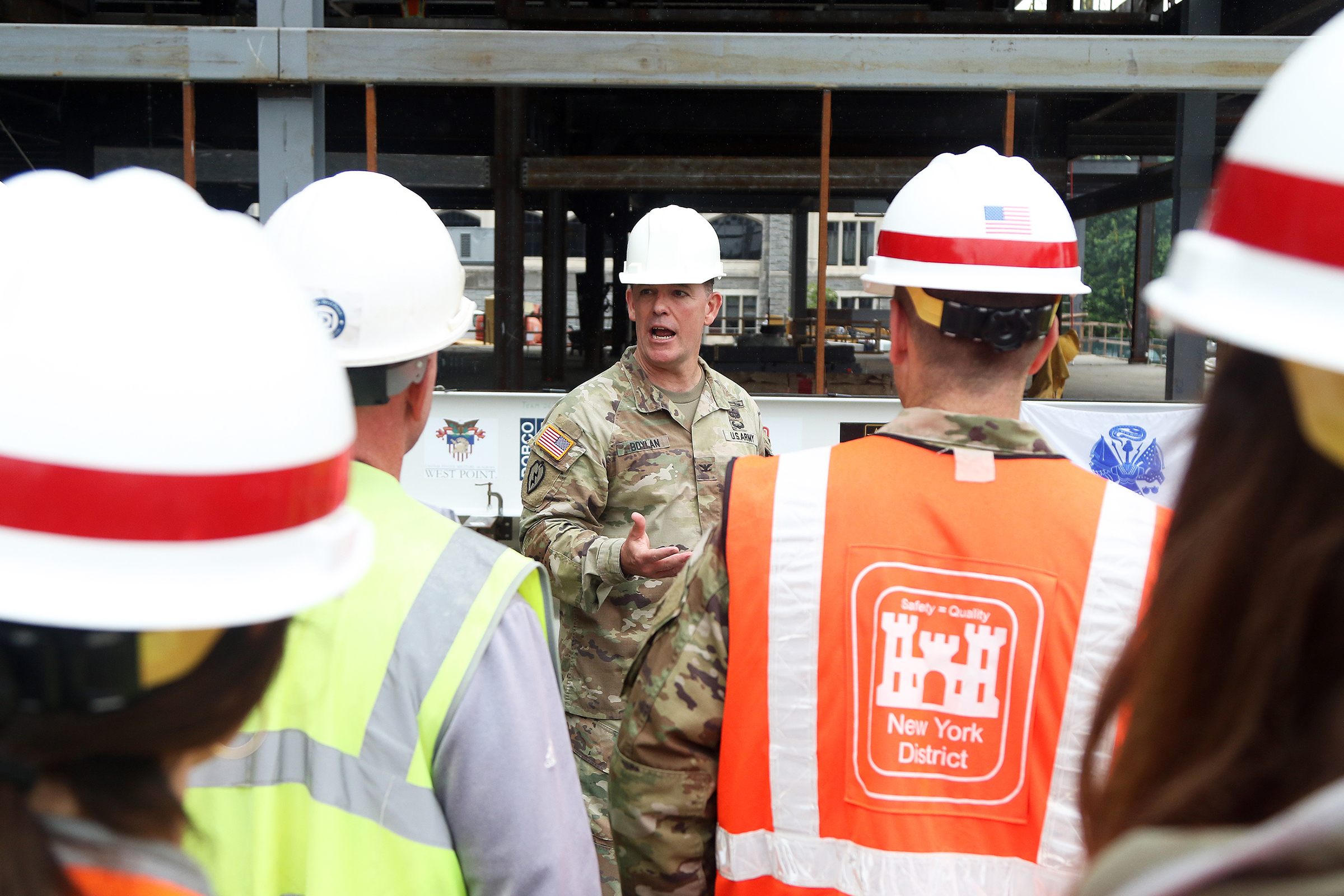 One of the final beams was placed on top of the future Cyber and Engineering Academic Center (CEAC) during a ceremony June 22 at the U.S. Military Academy. Traditionally, a beam topping ceremony is the celebration of the last beam placed on the building and marks a major milestone in the construction process of that building.  (Photo by Eric S. Bartelt/PV)