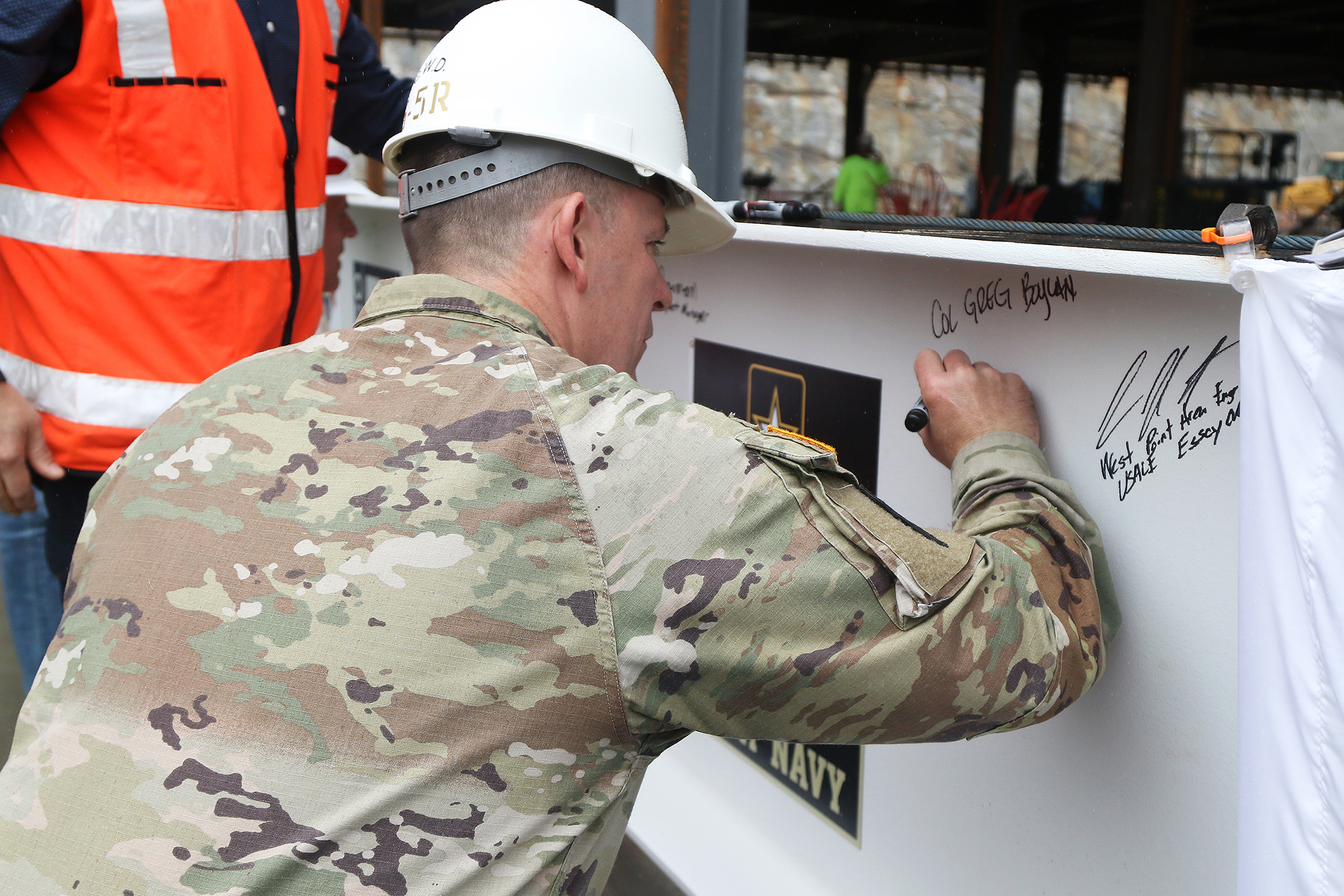 One of the final beams was placed on top of the future Cyber and Engineering Academic Center (CEAC) during a ceremony June 22 at the U.S. Military Academy. Traditionally, a beam topping ceremony is the celebration of the last beam placed on the building and marks a major milestone in the construction process of that building.  (Photo by Eric S. Bartelt/PV)