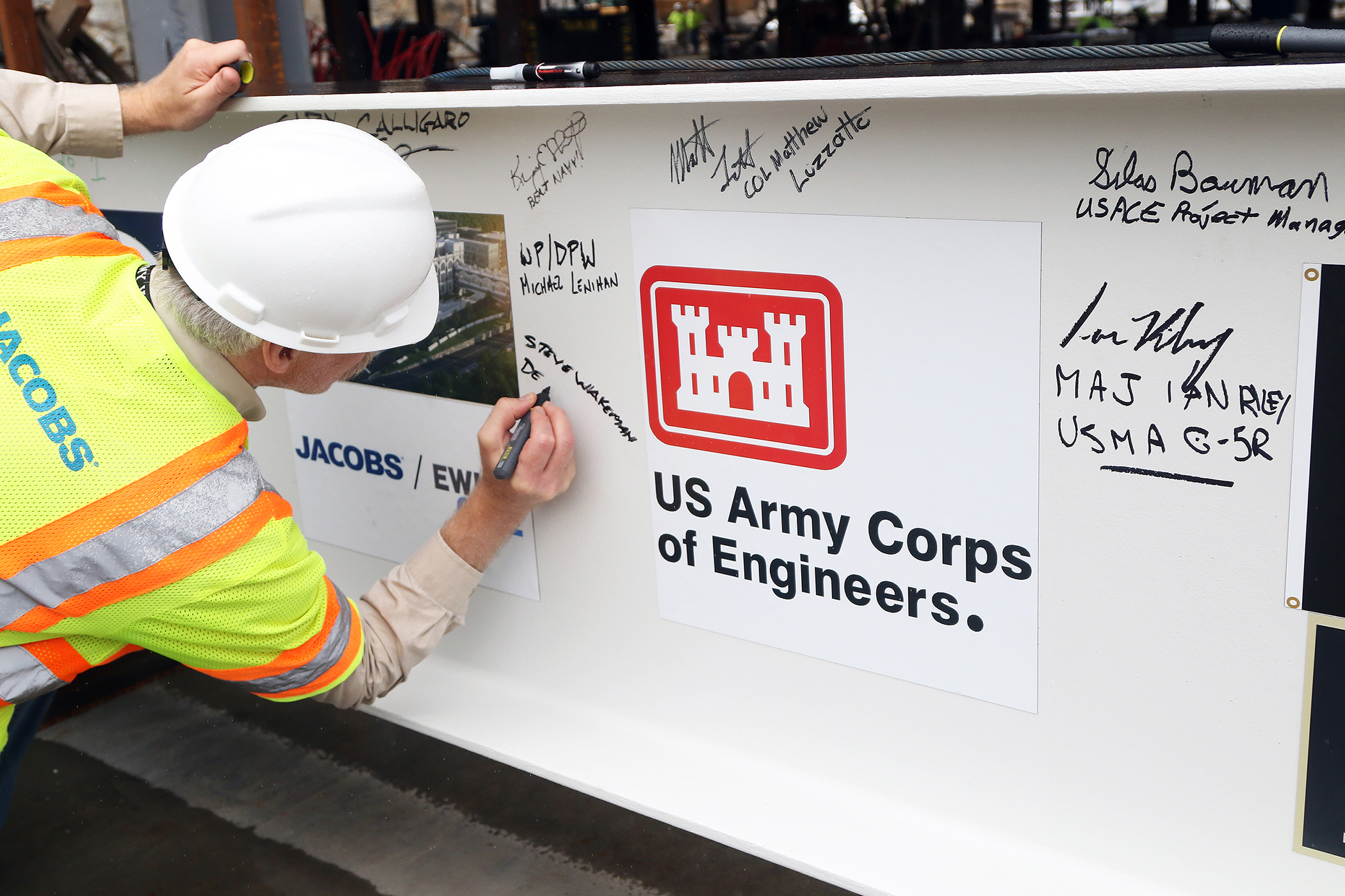 One of the final beams was placed on top of the future Cyber and Engineering Academic Center (CEAC) during a ceremony June 22 at the U.S. Military Academy. Traditionally, a beam topping ceremony is the celebration of the last beam placed on the building and marks a major milestone in the construction process of that building.  (Photo by Eric S. Bartelt/PV)