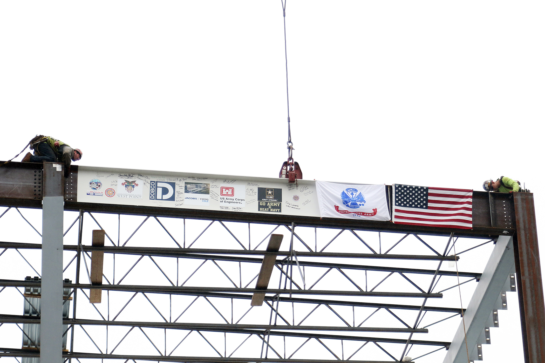 One of the final beams was placed on top of the future Cyber and Engineering Academic Center (CEAC) during a ceremony June 22 at the U.S. Military Academy. Traditionally, a beam topping ceremony is the celebration of the last beam placed on the building and marks a major milestone in the construction process of that building.  (Photo by Eric S. Bartelt/PV)