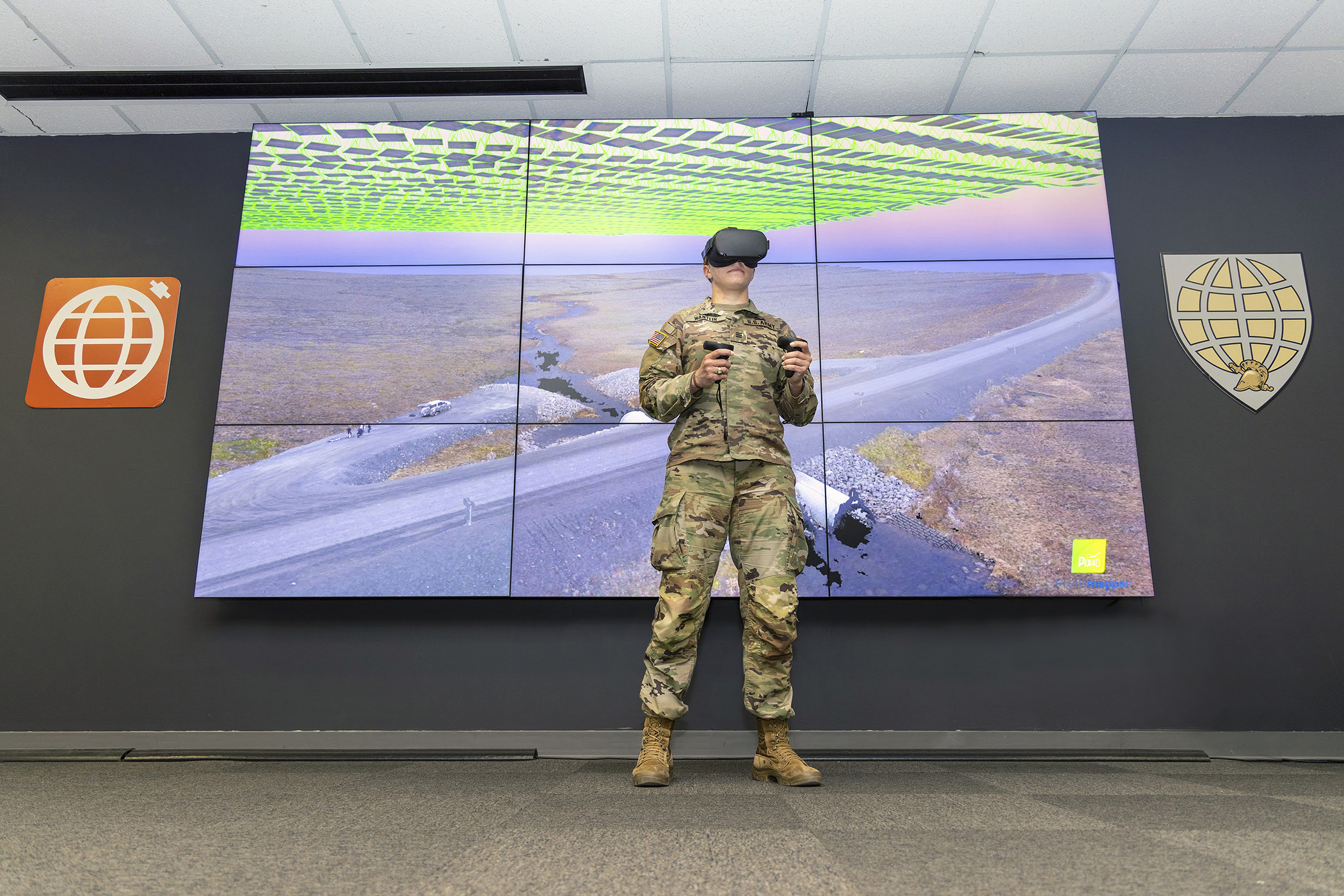 U.S. Military Academy graduate, 2nd Lt. Nicole Wantlin, demonstrates her ability to take data collected over years of Arctic thaw cycles and view the landscape in 3D through virtual reality technology to detect changes in terrain features on April 21, 2022, at Washington Hall. 