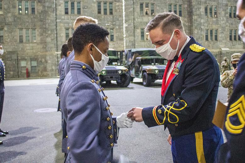 Members of the Class of 2024 receive their National Defense Service Medal, which honors their commitment to serve during a time of conflict, Saturday in Central Area.