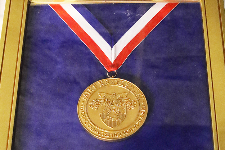 A close-up of the annual Coach Mike Krzyzewski Teaching Character Through Sport Award medallion that was presented to Class of 2022 Cadet Stephanie Dolehide and the other winners and runners-up May 6 in a combined virtual, via Microsoft Teams, and in-person ceremony at the Cadet Mess Hall. 