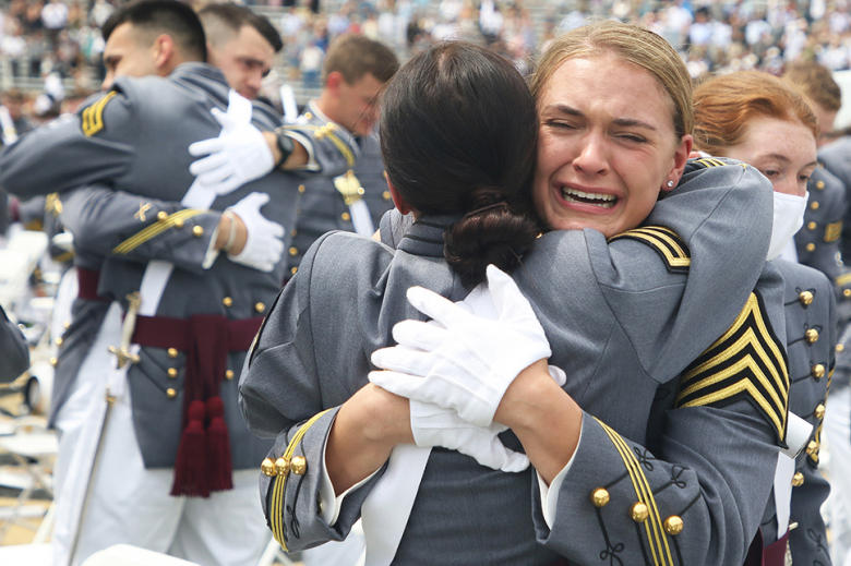 Two new second lieutenants from the USMA Class of 2021 emotionally embrace after the hat toss.MA Class of 2021 emotionally embrace after the hat toss.