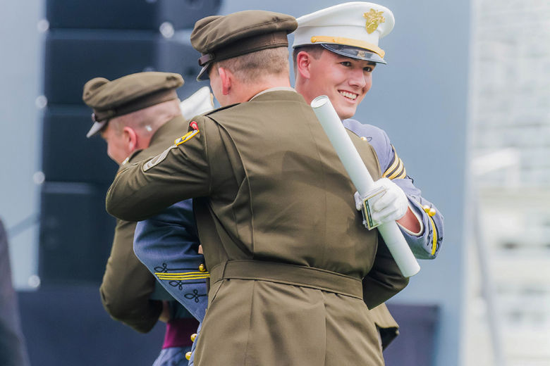 After receiving his diploma, a Class of 2021 cadet hugs his company tactical noncommissioned officer during the U.S. Military Academy Graduation and Commissioning Ceremony Saturday at Michie Stadium. 