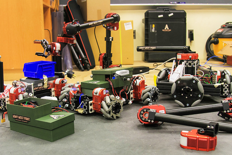 More than 300 capstone projects were featured at the 22nd annual Projects Day highlighting innovative designs linked to Army readiness, modernization and warfighting capabilities at multiple locations April 29 at West Point. Since May 2000, Projects Day assembles U.S. Military Academy cadets to showcase their intellectual capital and work with faculty and external collaborators while celebrating their bold innovations. (Above and inset) Team Warehouse Autonomous Robots (WAR) displays the robots they built