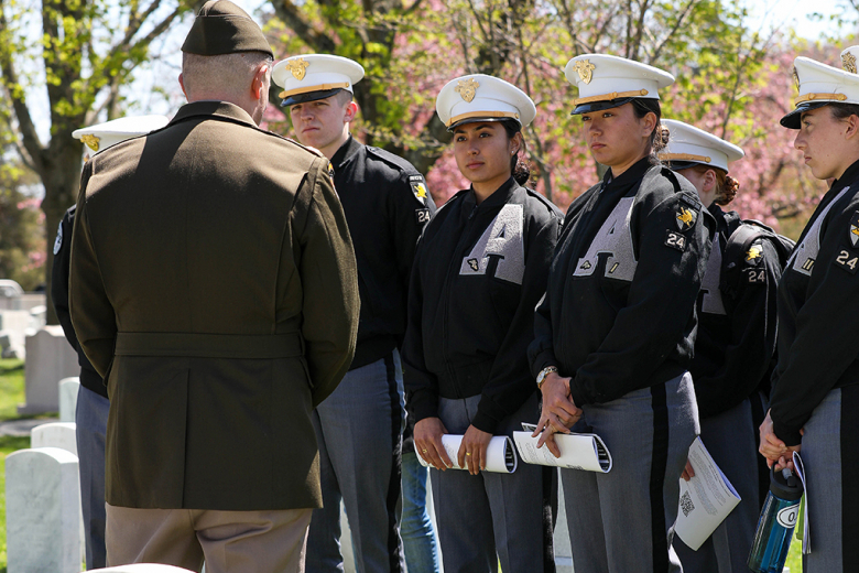 Class of 2024 Cadet Lara Westwood-Marsh, from Company B-4, center, reflects as Maj. Benjamin Elliot speaks on behalf of a fallen friend, 1st Lt. Todd Lambka, April 29 in the West Point Cemetery.