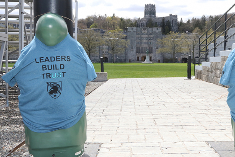 Those who trekked the Walk A Mile viewed silhouettes along the path wearing T-shirts that represented cadets who experienced some form of unwanted sexual contact.