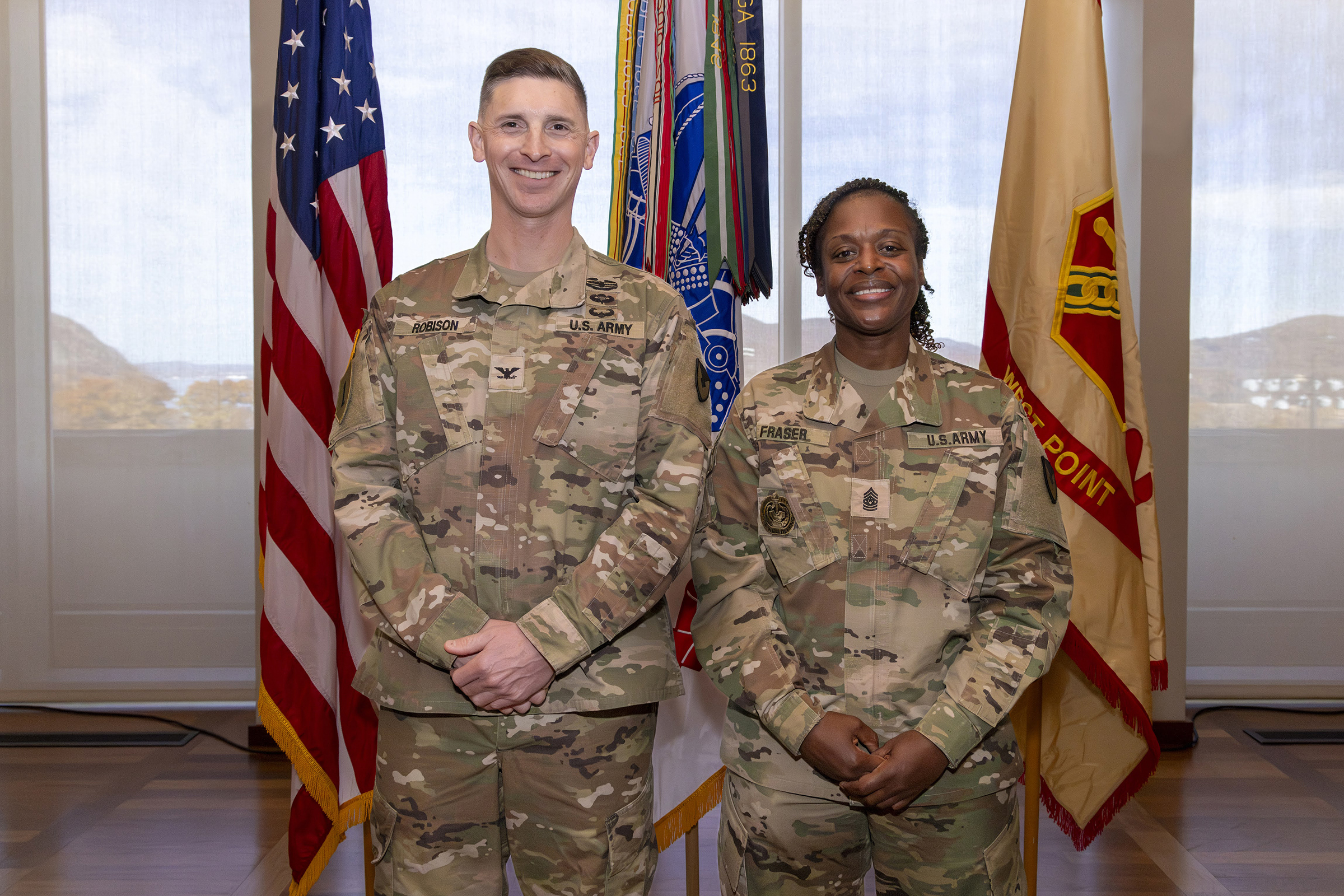 The U.S. Army Garrison West Point and the U.S. Army Installation Management Command (IMCOM) hosted the Assumption of Command ceremony of Col. Travis E. Robison Nov. 15 in the Haig Room in Jefferson Hall. During the ceremony, Robison received the unit guidon to take command from Kathryn E. McNeely, the director (acting) of IMCOM – Training, with Command Sgt. Maj. Michel R. Fraser, Garrison West Point command sergeant major, also a part of the assumption of command unit colors exchange. 