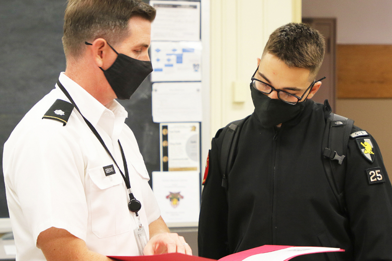 Col. Michael Benson, director of Mechanical Engineering division in the Department of Civil and Mechanical Engineering, and Lt. Col. Jeffrey Gibbons, professor in the Department of English and Philosophy, speak to prospective cadets looking at possibly majoring in their departments.	(Photos by Delancey Pryor III/PV)