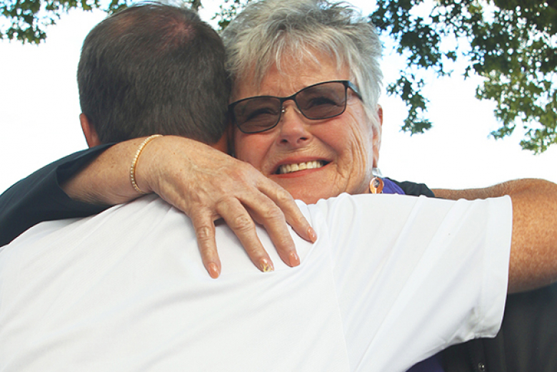 Rebecca McConnell, widow of seven-time Purple Heart recipient Randy McConnell, receives the American flag that flew over West Point on Sept. 30. 