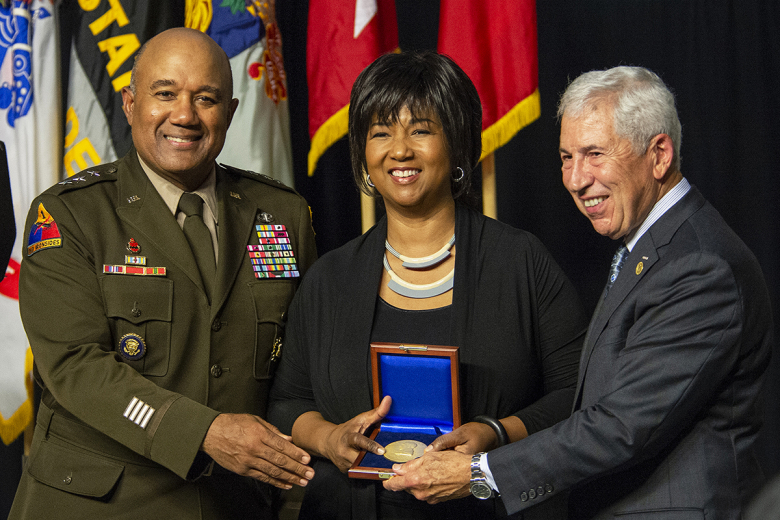 Mae C. Jemison, the 2021 Thayer Award recipient, accepts the Thayer Award from Superintendent Lt. Gen. Darryl A. Williams (left) and retired Lt. Gen. Joseph DeFrancisco, chairman of the West Point Association of Graduates, during the Thayer Award Banquet in Washington Hall on Oct. 7. 