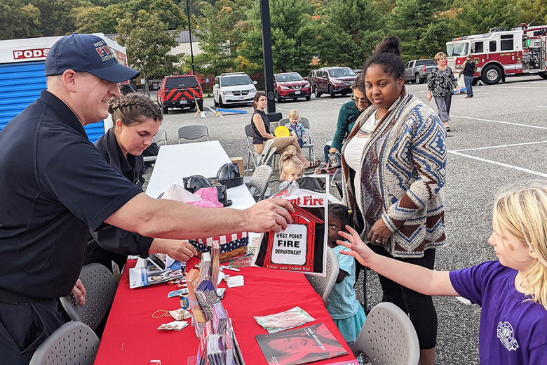Members of the West Point community attended the West Point Fire Department’s Open House event at West Point’s Commissary and PX Parking Lot on Oct. 12. Firefighters provided food and information, while demonstrating their gear, equipment and techniques they use when responding to an emergency.    		(Photo by Dave Conrad/Garrison PAO) 