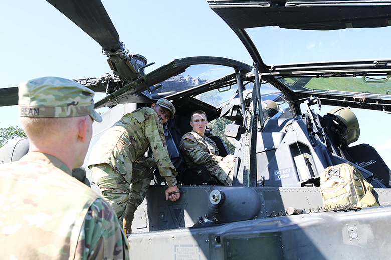 A cadet sits in the cockpit of an Apache taking in information from its crew during Branch Week festitives Tuesday at West Point. Branch Week is an annual event that allows cadets to learn more about the 17 U.S. Army branches.  