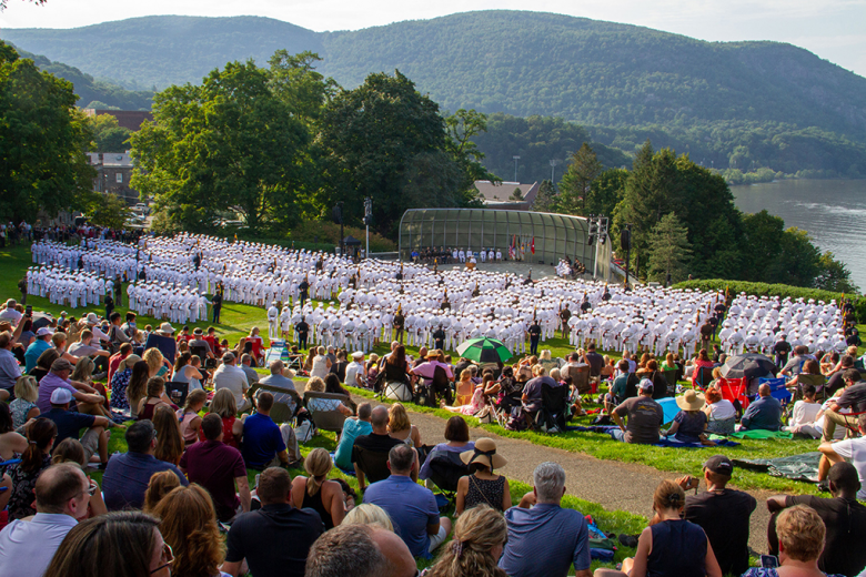 Members of the U.S. Military Academy Class of 2022 enthusiastically show off their rings after they received them during the annual Ring Weekend ceremony Friday in front of family and friends (right) at the Trophy Point Amphitheater. The weekend also included a run and banquet to celebrate the milestone event. The tradition of the class ring at USMA first began in 1835. Years later, Ron Turner, USMA Class of 1958, developed the idea of incorporating the gold of alumni rings into the current classʼ rings. In