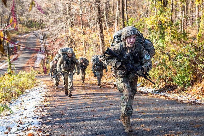The Company F-2 team ruck marches to its next mission Saturday at the Fall Sandhurst Competition. 