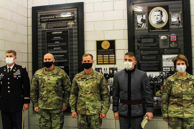 Class of 2021 Cadets Beaux Guffey (second from right) and Gabrielle White (not shown) are recognized by the Department of Physical Education Director Col. Nicholas Gist, U.S. Corps of Cadets command sergeant major Command Sgt. Maj. Kenneth Killingsworth, U.S. Corps of Cadets Commandant Brig. Gen. Curtis A. Buzzard and Dean of the Academic Board Cindy R. Jebb during the ninth annual Lt. Gen. Hal Moore Warrior Athlete of Excellence Award ceremony Nov. 12 at Arvin Cadet Physical Development Center. The Departm