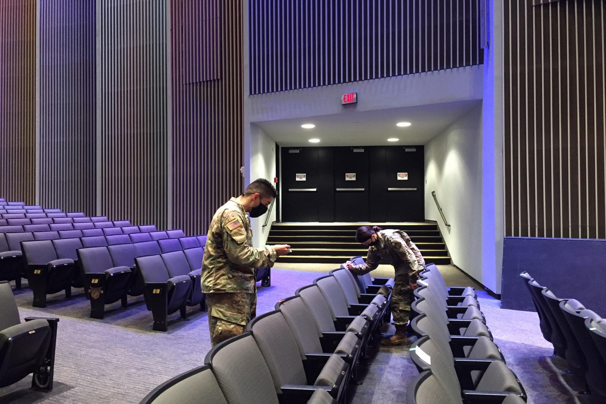 USMA Class of 2022 Cadet Andy Rodriguez, left, and Class of 2024 Cadet Emily Hobbs, right, mark off seats in Eisenhower Hall Theatre Sept. 10 ahead of the "We Stand Together" concert at the U.S. 