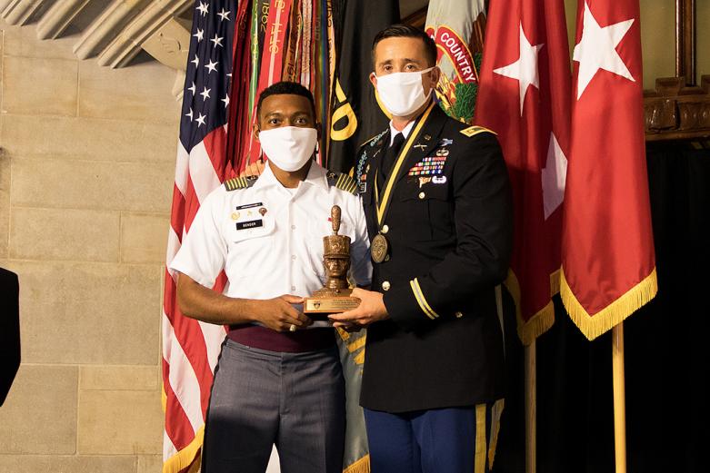 Meyer receives a gift from the Corps of Cadets, which is presented by Class of 2021 Cadet and Deputy Brigade Commander Tyrese Bender.	