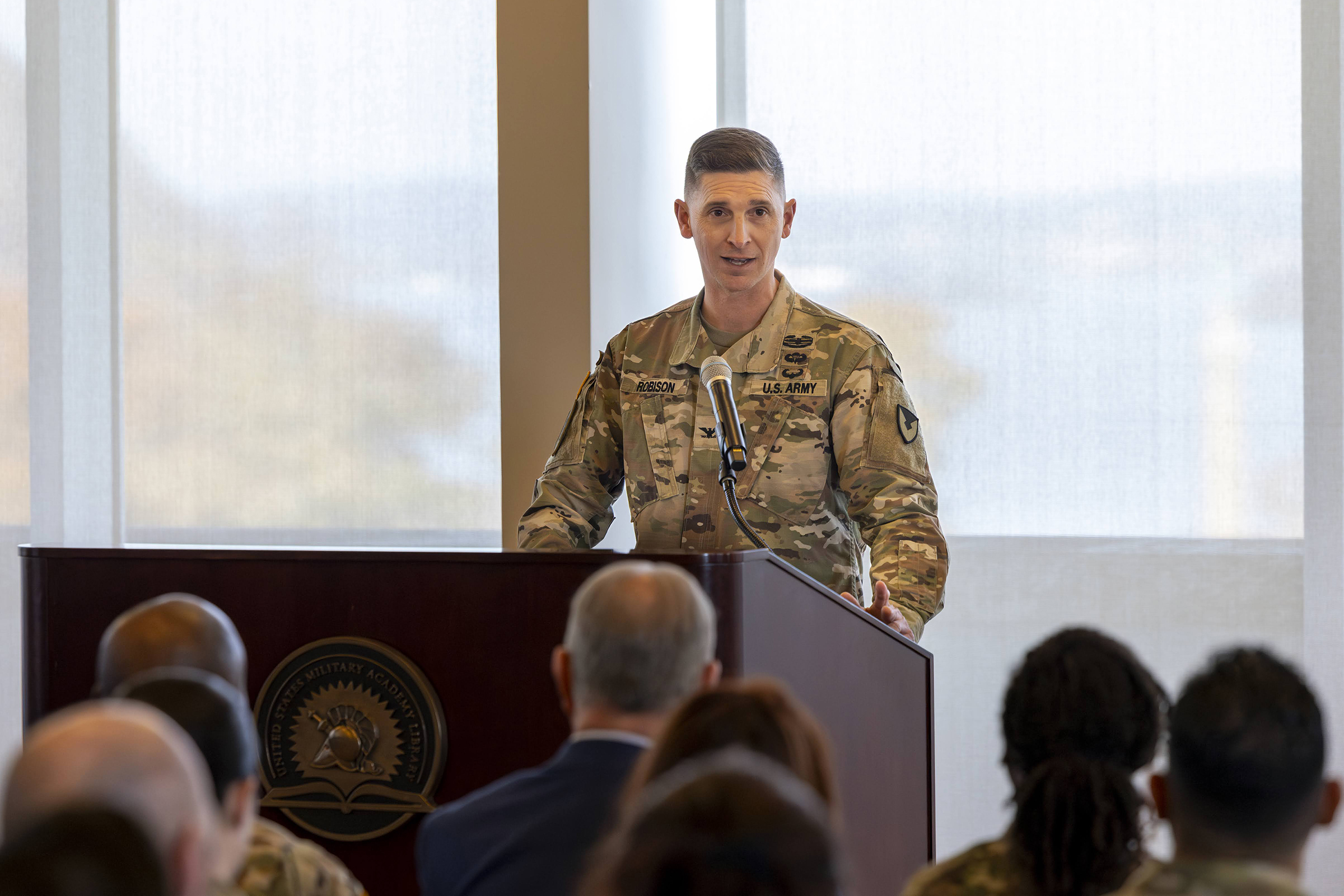 The U.S. Army Garrison West Point and the U.S. Army Installation Management Command (IMCOM) hosted the Assumption of Command ceremony of Col. Travis E. Robison Nov. 15 in the Haig Room in Jefferson Hall. During the ceremony, Robison received the unit guidon to take command from Kathryn E. McNeely, the director (acting) of IMCOM – Training, with Command Sgt. Maj. Michel R. Fraser, Garrison West Point command sergeant major, also a part of the assumption of command unit colors exchange. 