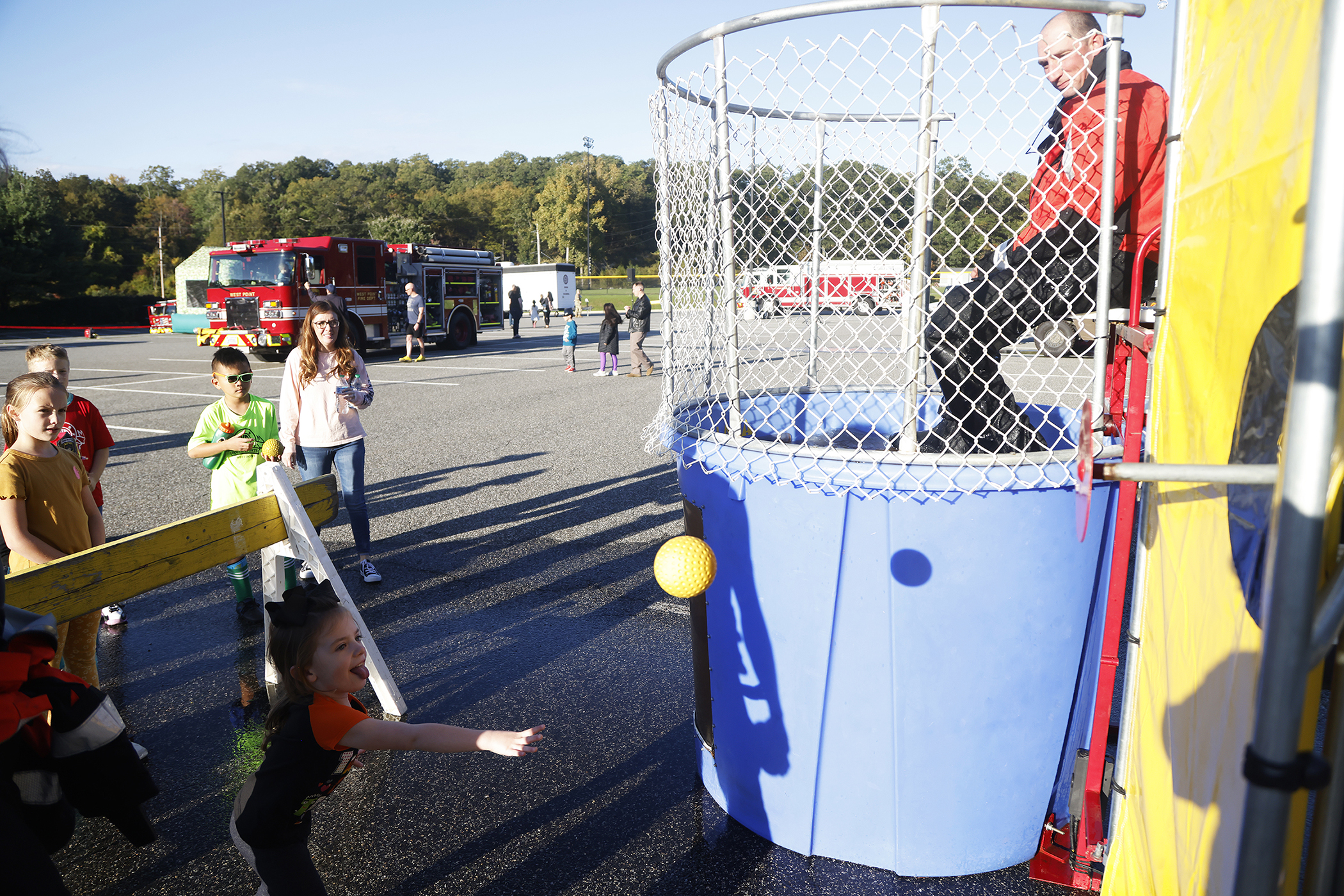 The West Point Fire Department (WPFD) presented its annual Open House for the West Point community Oct. 11 at H Lot in the Post Exchange parking lot. The WPFD offered activities to the children including the Kids Firefighting Obstacle Course with firefighting gear, Fire Extinguisher Training, Bounce House, Fire Truck displays, Cornhole, Dunk a Firefighter and the announcement of the Fire Prevention Week Poster Contest winners.   (Photo by Eric S. Bartelt/PV)