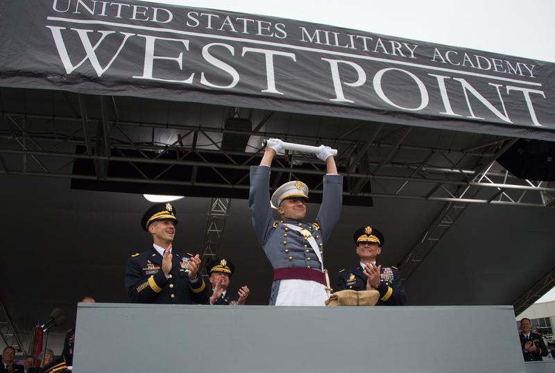 West Point's Goat receives his diploma and cash from his classmates at his graduation ceremony
