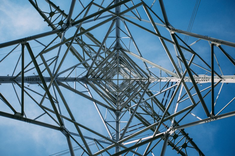 view of electrical tower from the bottom up