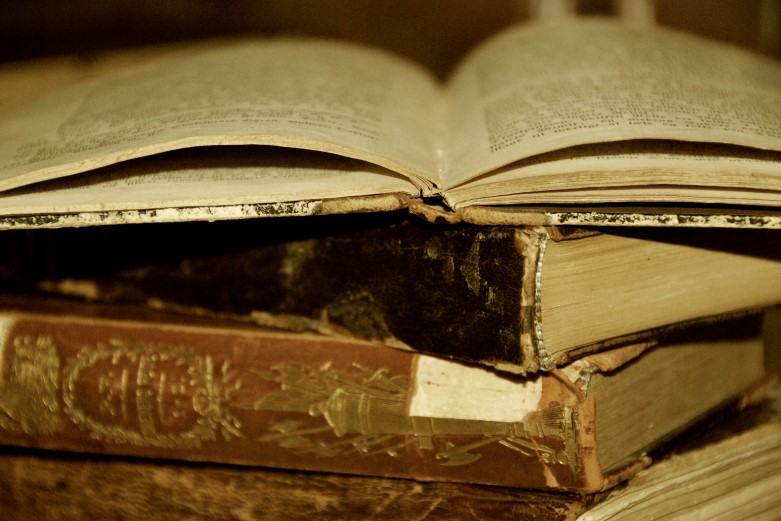 Stack of ancient looking books.