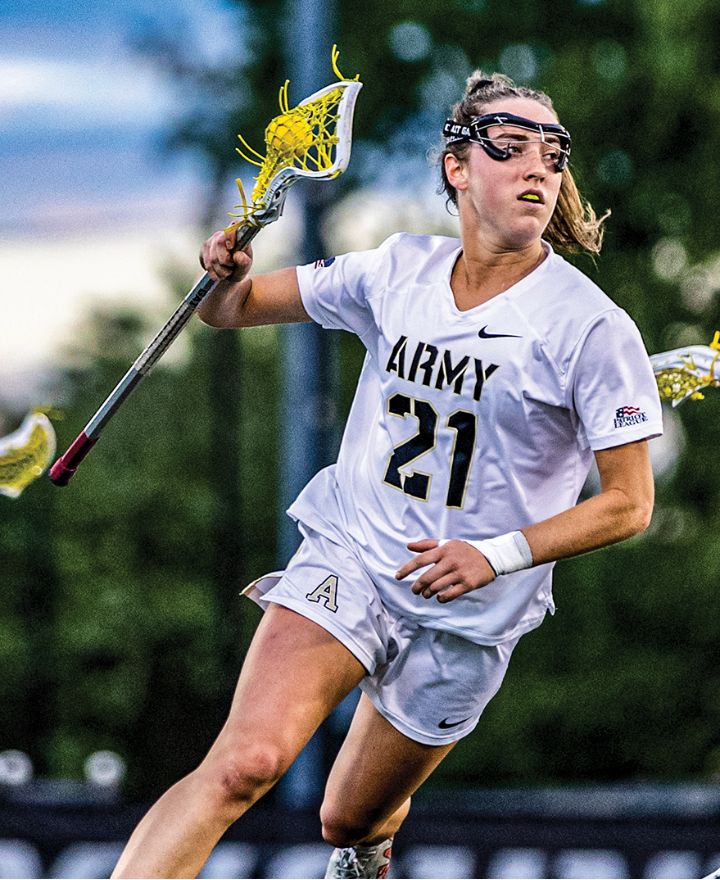 female cadet playing lacrosse