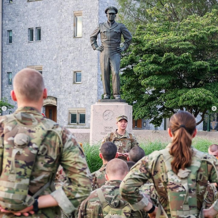 Cadets in front of a statue of Dwight D. Eisenhower