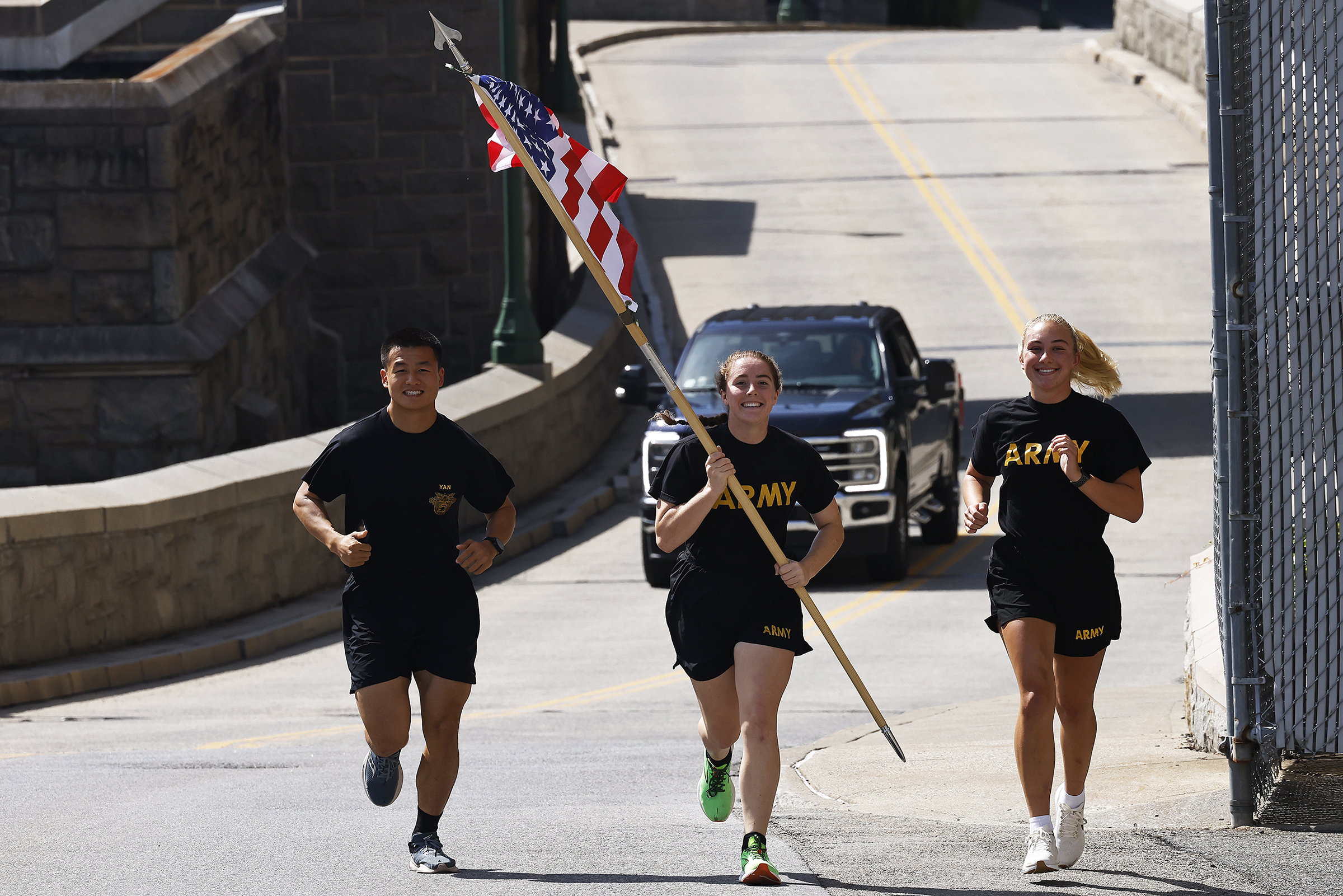 Members of 2nd Battalion, 4th Regiment of the U.S. Military Academy Corps of Cadets commemorated the victims of the 9/11 terrorist attacks in 2001 by running the American Flag throughout Central Area to the West Point Cemetery and back throughout the day on Sept. 11 at West Point.  (Photo by Eric S. Bartelt/USMA PAO)
