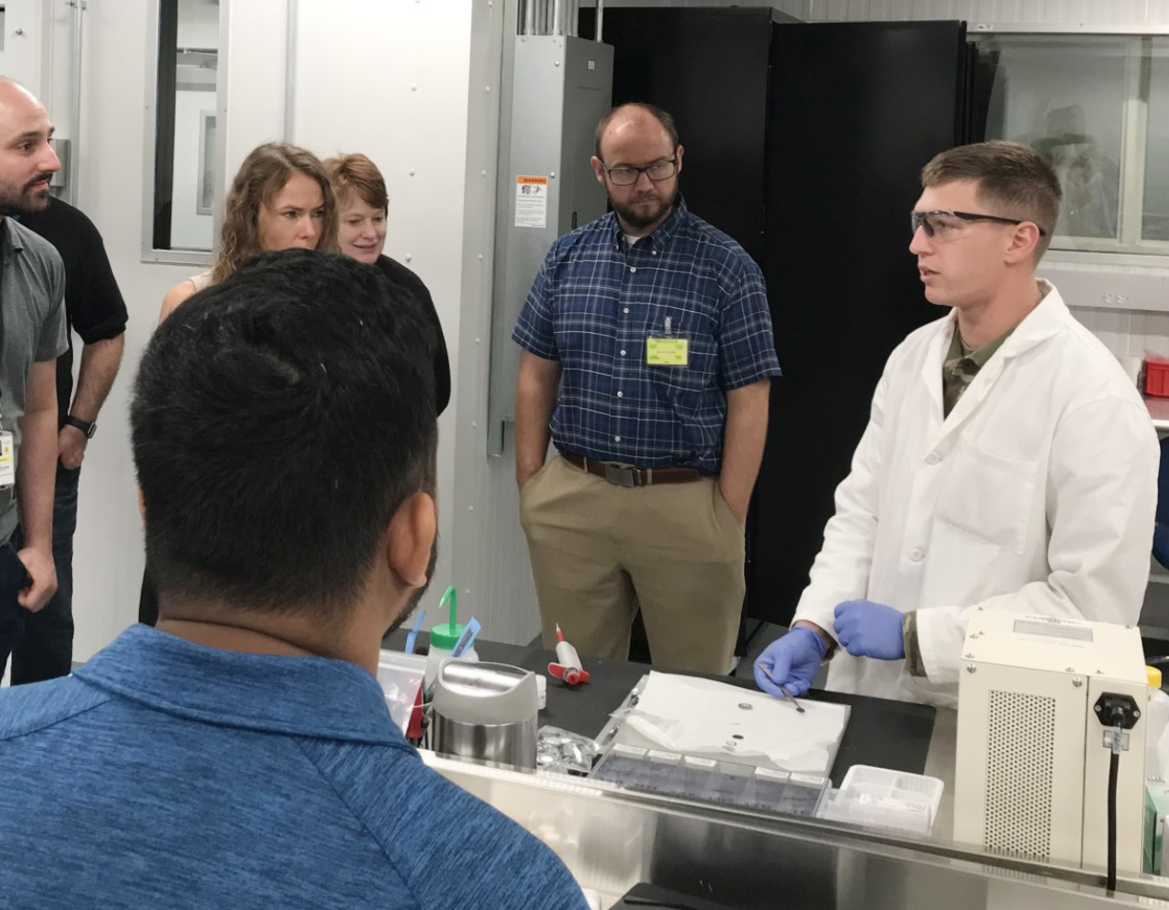 Cadets demonstrate how to build a coin cell battery, building connections with research partners across the Department of Defense.  (Courtesy Photo)