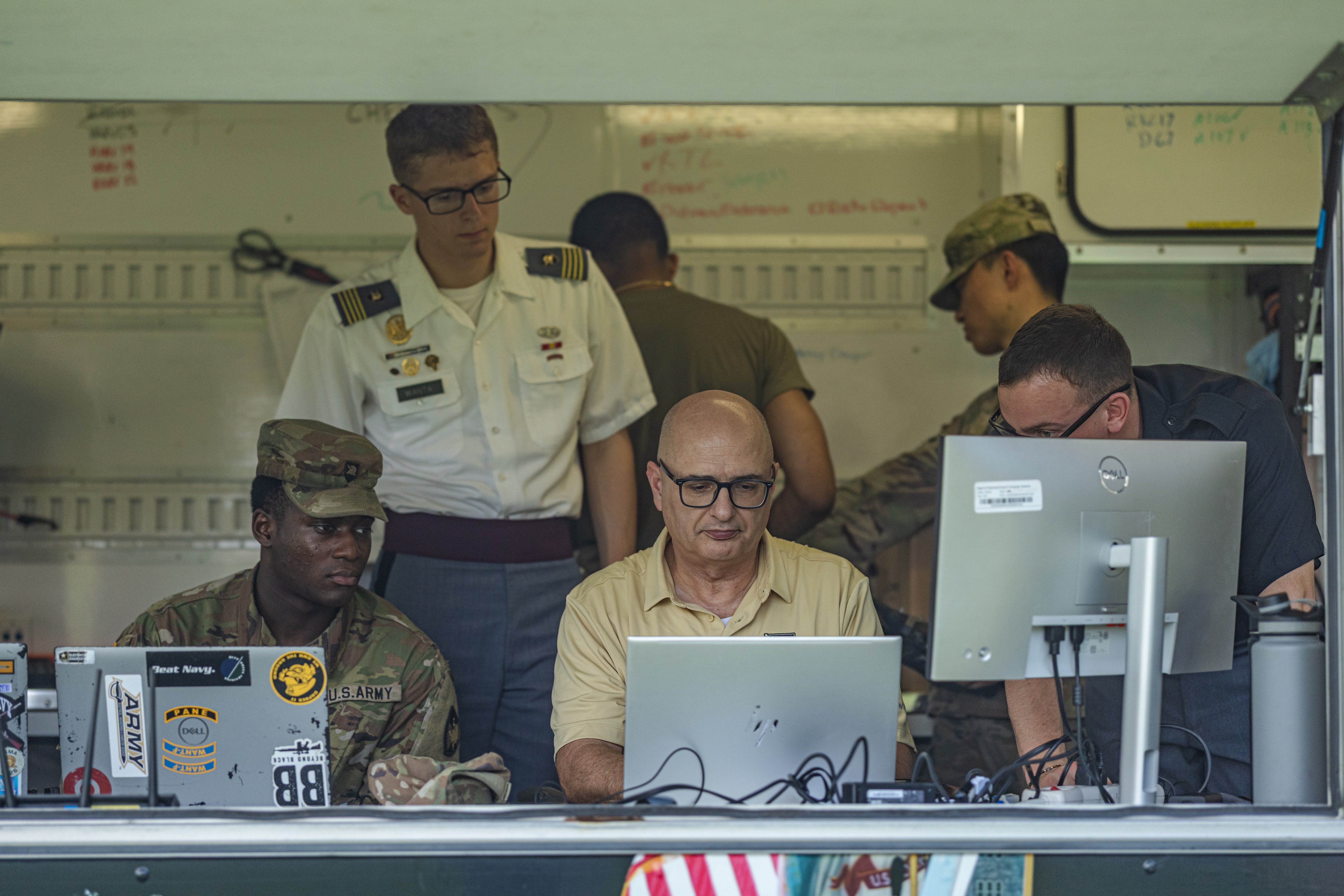 Team Swarm Troopers gathered at South Dock to assess their drones as they performed aerial tests to determine their effectiveness with mine detection, among other aspects, April 15 at the U.S. Military Academy.  (Photo by Jorge Garcia/USMA PAO-VI)