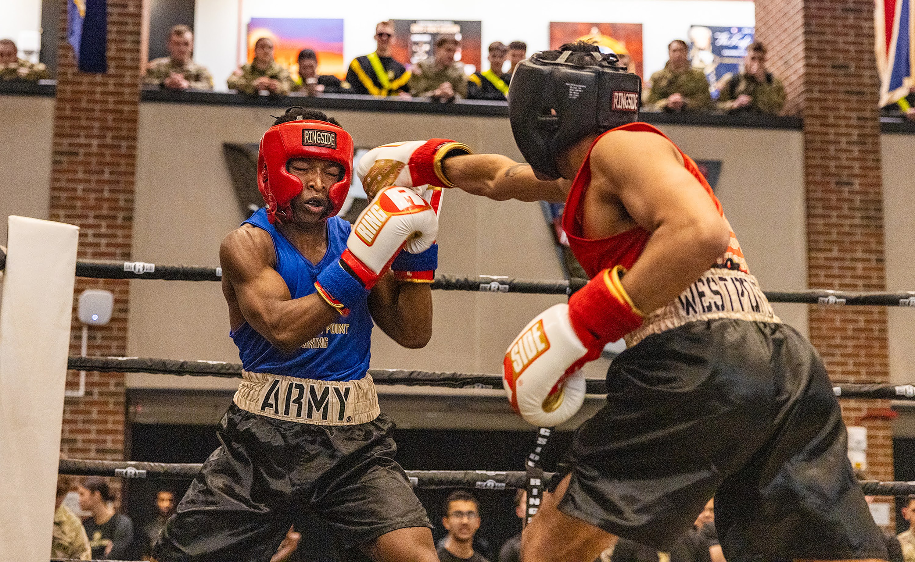The U.S. Military Academy hosted the 70th annual Brigade Boxing Open Finals on Feb. 20 at Crest Hall.  There were 10 bouts on the evening, incuding seven men's bouts and three women's fights. Overall, there were 18 BBO winners with the other fights happening the previous day.  There were eight new BBO champions and 10 champions who now won multiple BBO titles.  (Photo by Eric S. Bartelt / USMA PAO-VI)